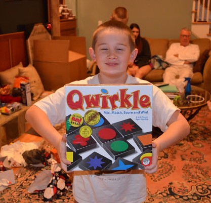 Grandma and Grandpa got Timmy a bunch of brainy games, such as this one, Qwirkle, which he plays at school.