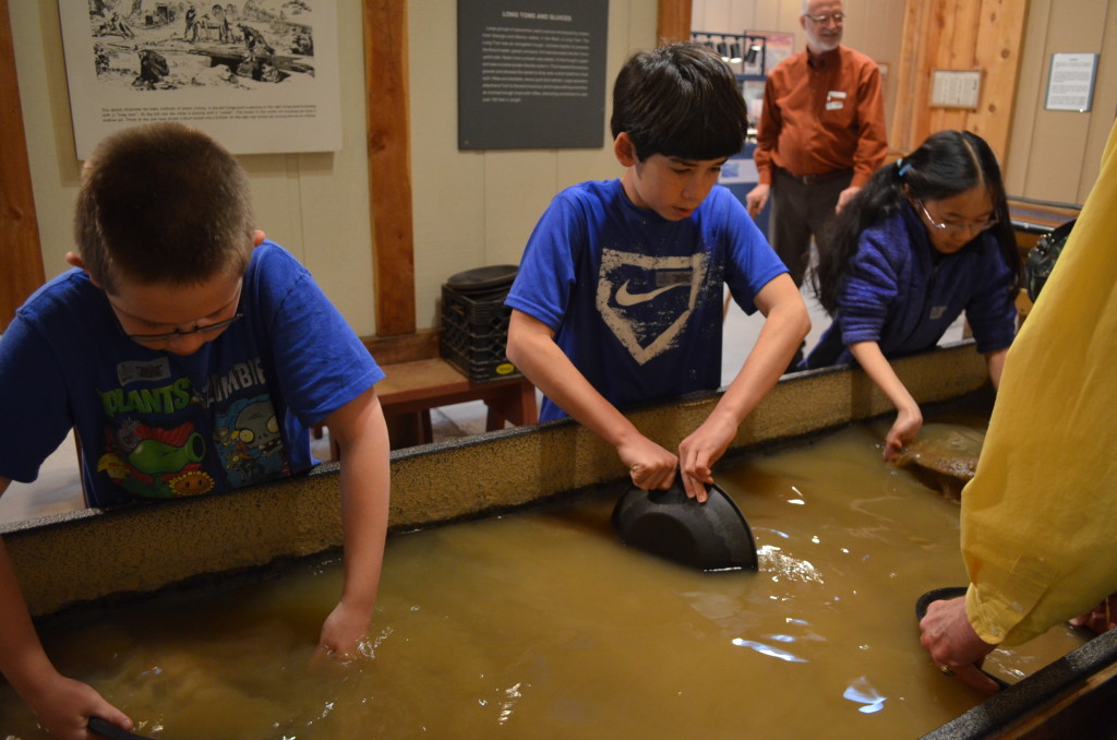 The boys trying their hands at "placer mining". This was real river bed placer material from near Cripple Creek. Real gold had been found by museum visitors, but we didn't find any.