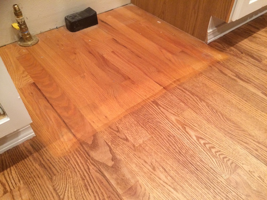 I was able to grab this picture of the "before" and "after" floor colors when we moved the oven out of the way.